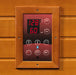 Digital control panel with temperature display on a wooden background