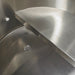 Close-up of a stainless steel cold plunge with a drain.