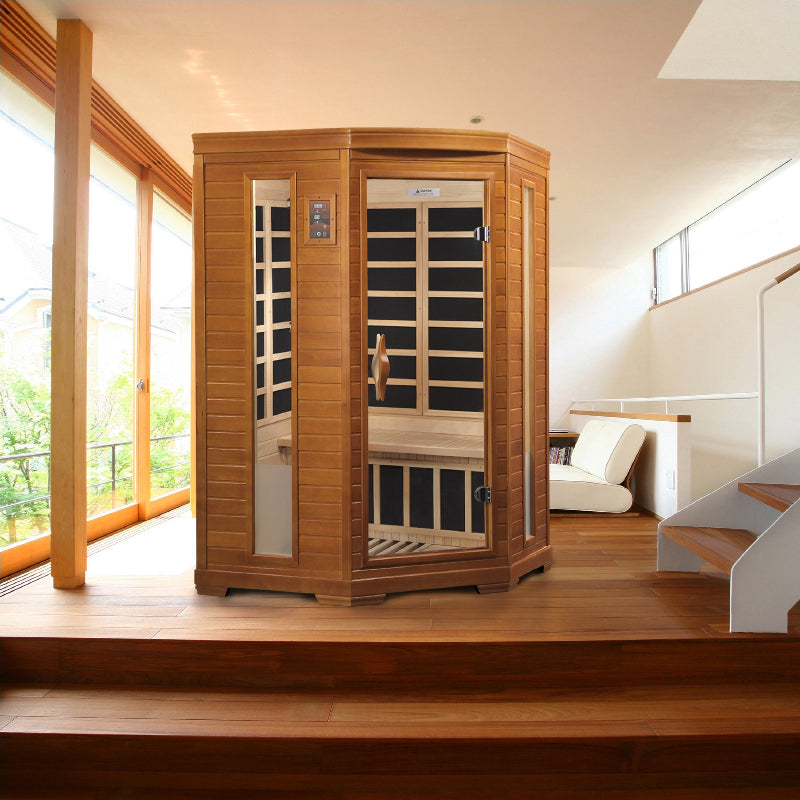 Wooden sauna in a modern room with large windows