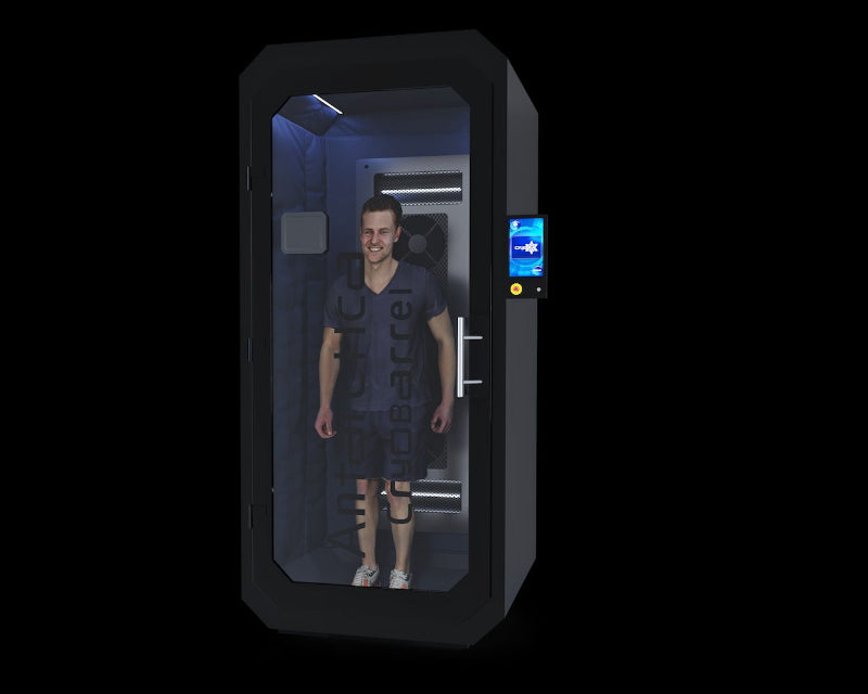 black cryo therapy chamber with gray box on glass man standing inside with a black background