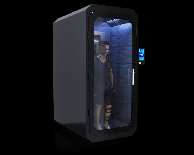 black cryo chamber with man inside on black background