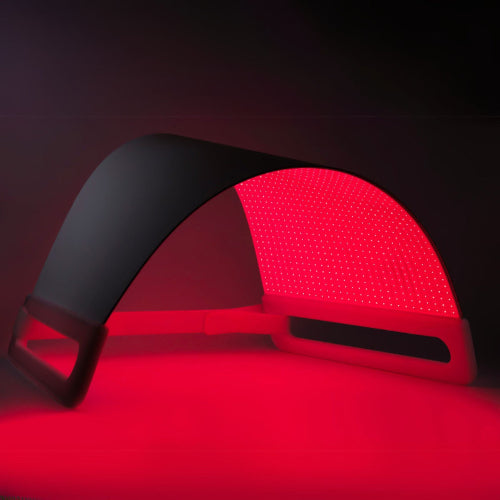 Red LED light panel with black border on a dark background