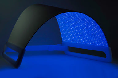 Blue LED light pad on a dark background