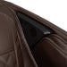 Close-up of a brown car seat with a speaker embedded in it.