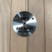 Metallic round label with 'MP3 AUX INPUT MAX: 175mV' text on a wooden background