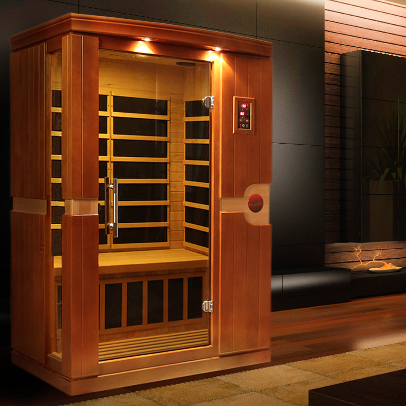 Wooden sauna with glass door in a dimly lit room